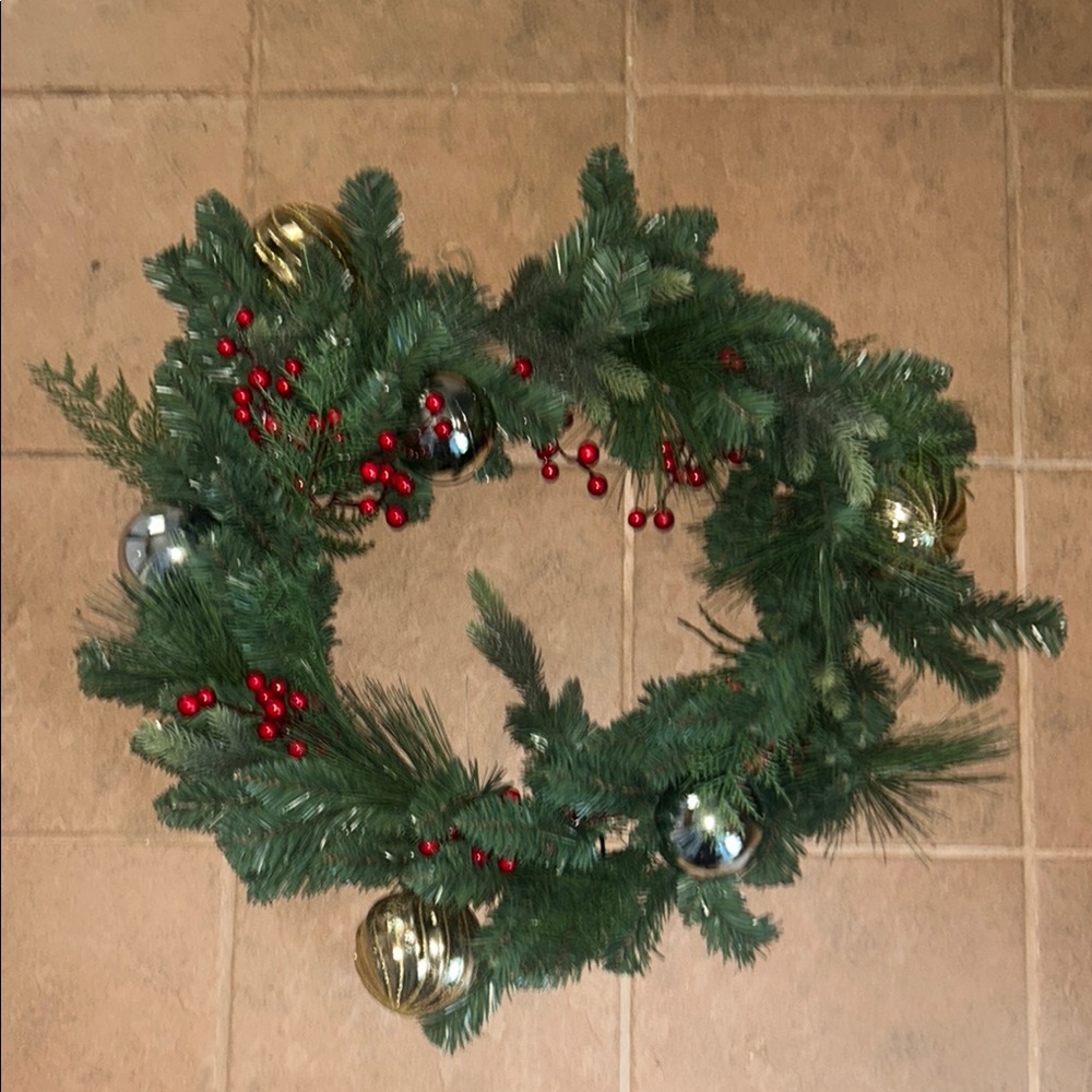 Festive Green Holiday Wreath with Red Berries and Gold Ornaments